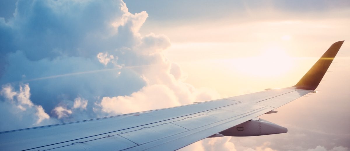 Modern international airport terminal with travelers finding cheap flights
