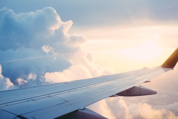 Modern international airport terminal with travelers finding cheap flights