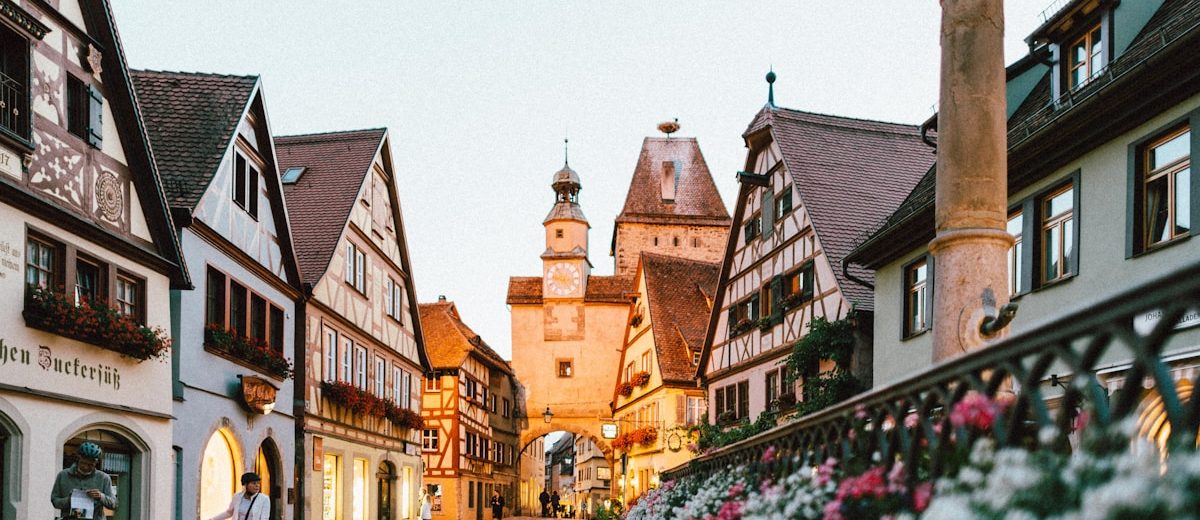 Charming cobblestone European street with colorful buildings and cafes