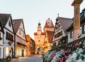 Charming cobblestone European street with colorful buildings and cafes