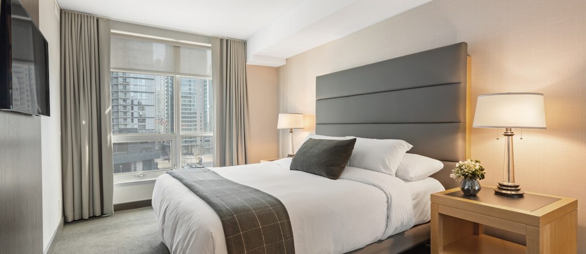Elegant luxury hotel room with panoramic window views